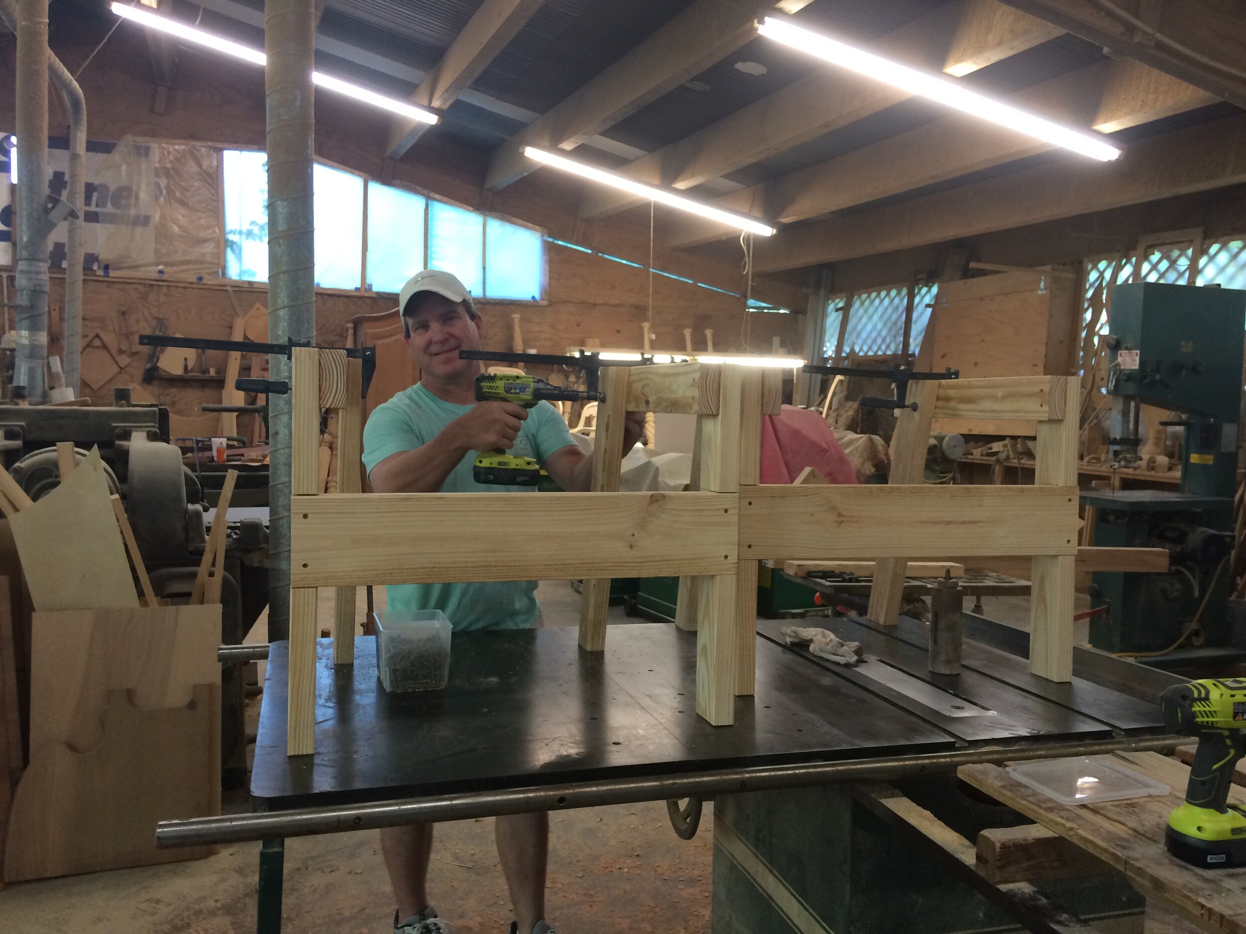 Hands at work on cypress in the workshop