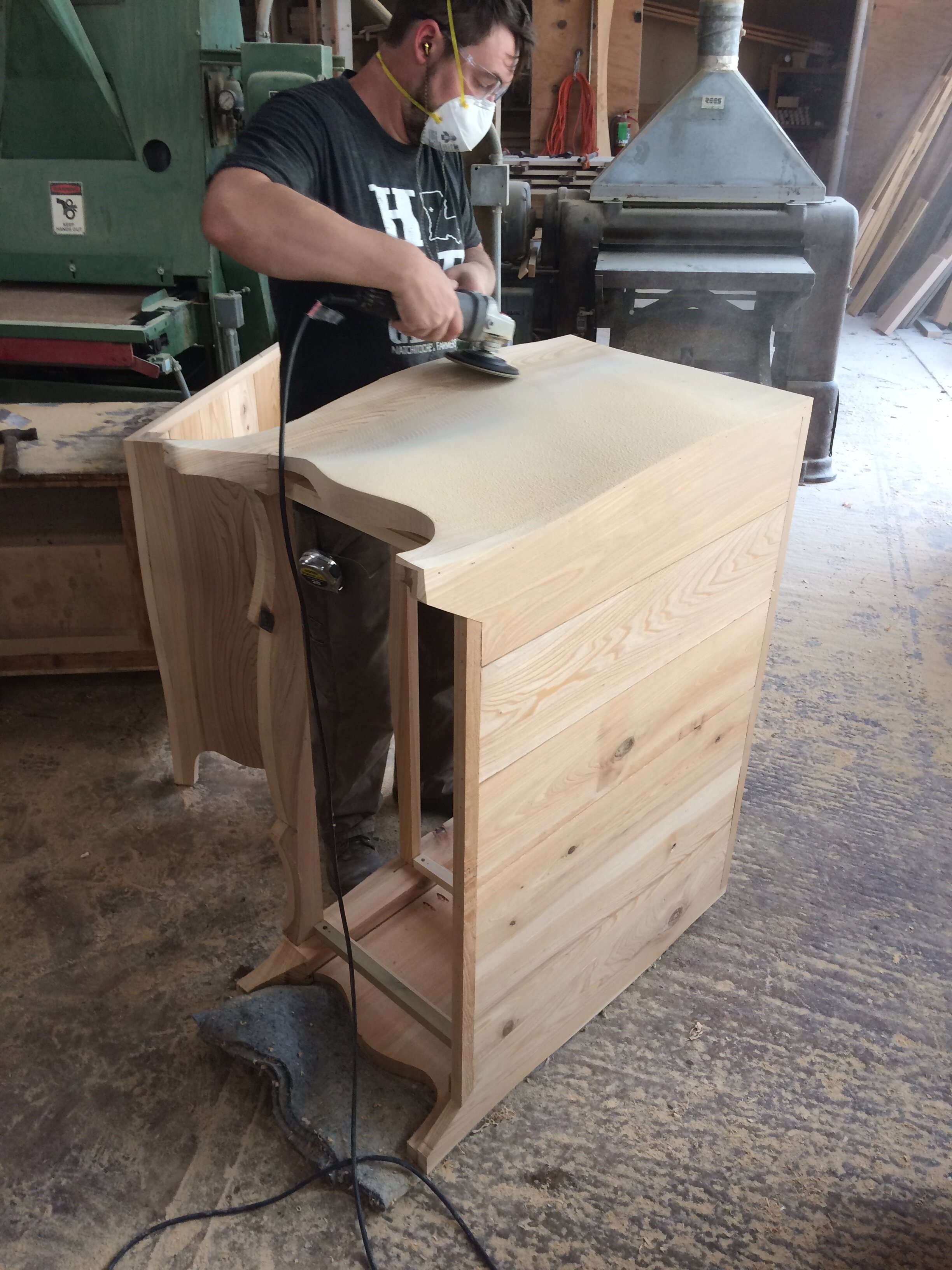 Hand finishing a piece of furniture